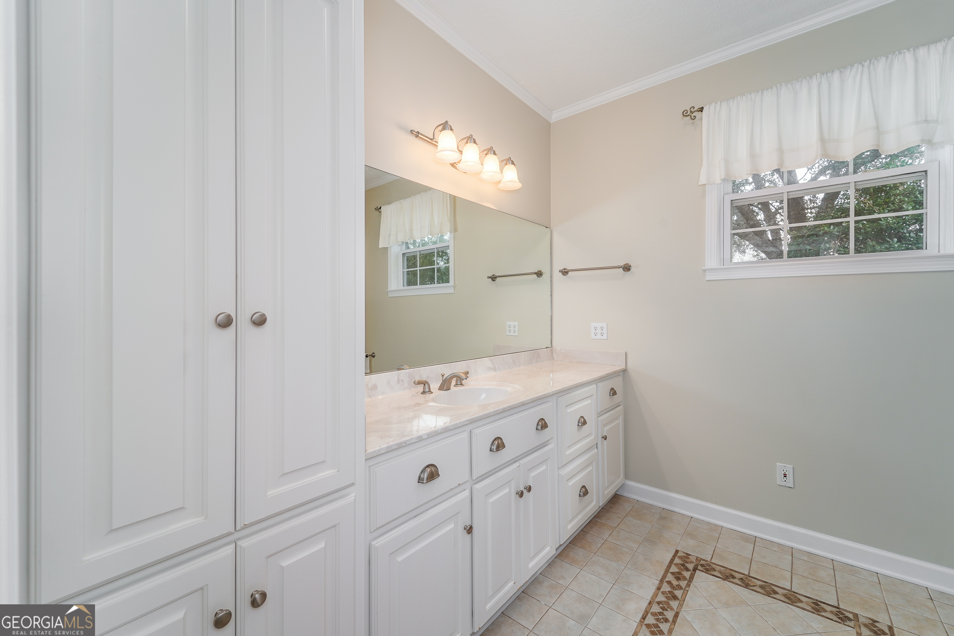 4023 Redstone Circle Blackshear, GA 31516 - Photo 22 of 27 a bathroom with a double vanity sink and a mirror