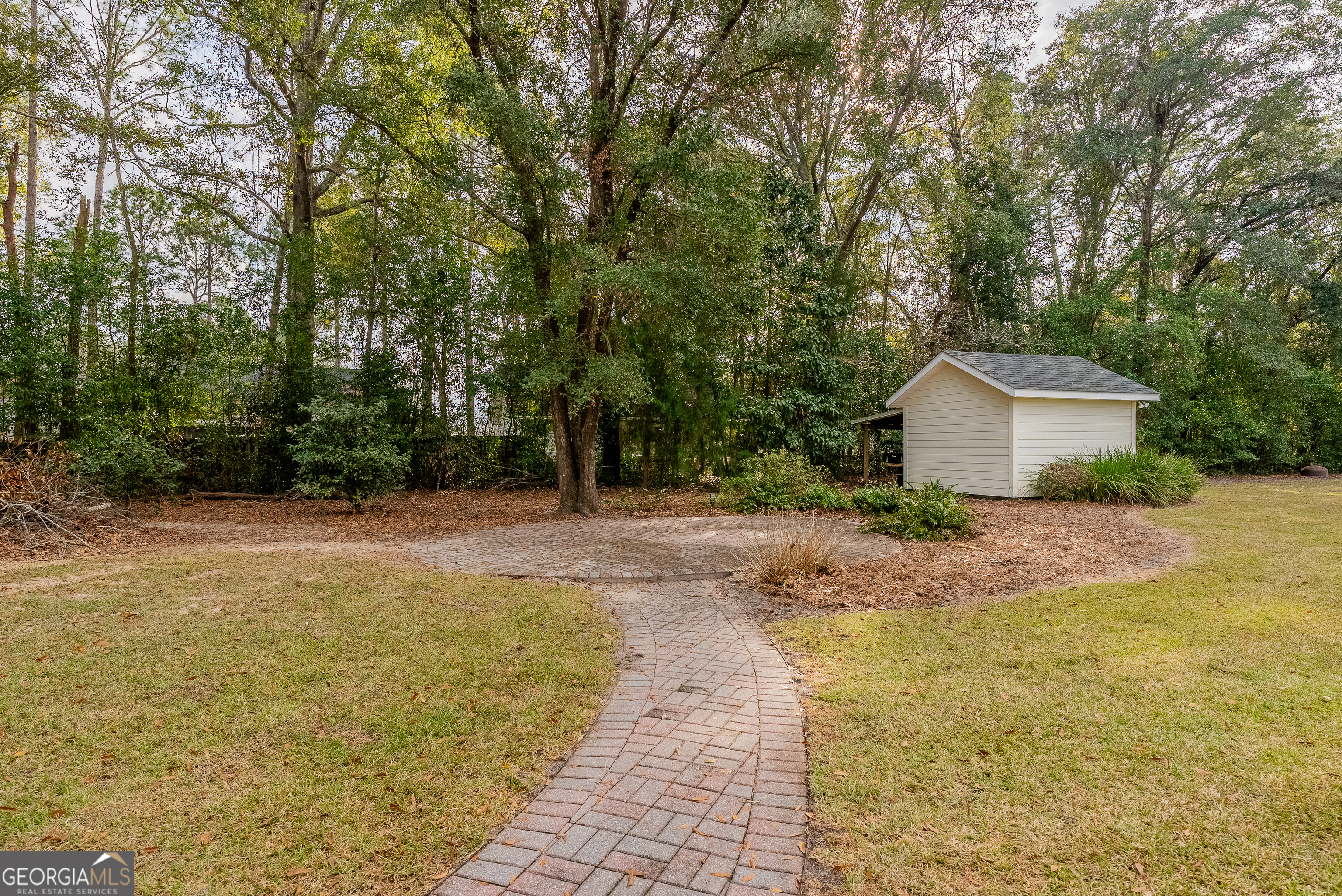 4023 Redstone Circle Blackshear, GA 31516 - Photo 4 of 27 a front view of a house with a yard and trees
