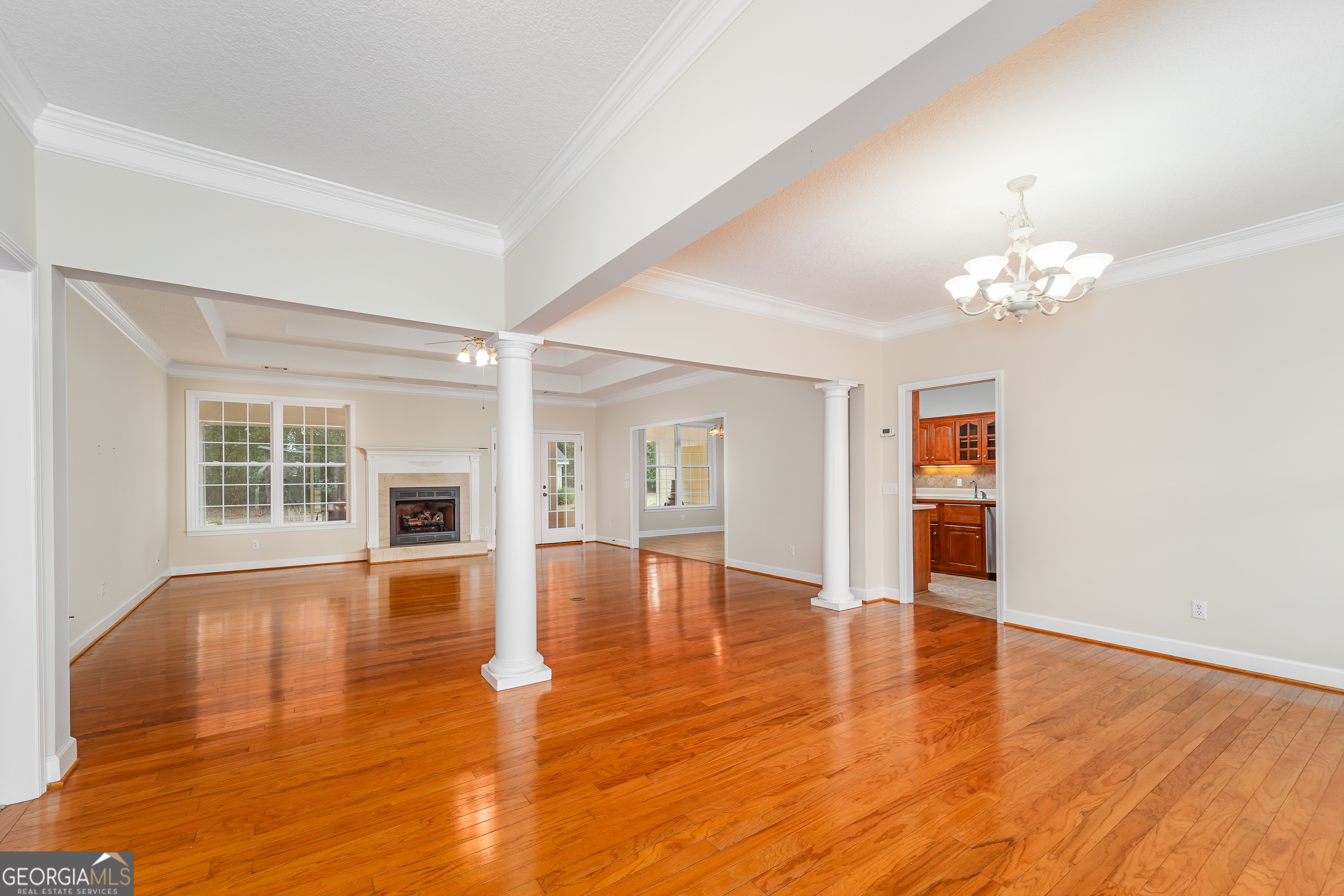 4023 Redstone Circle Blackshear, GA 31516 - Photo 9 of 27 a view of an empty room with window and wooden floor