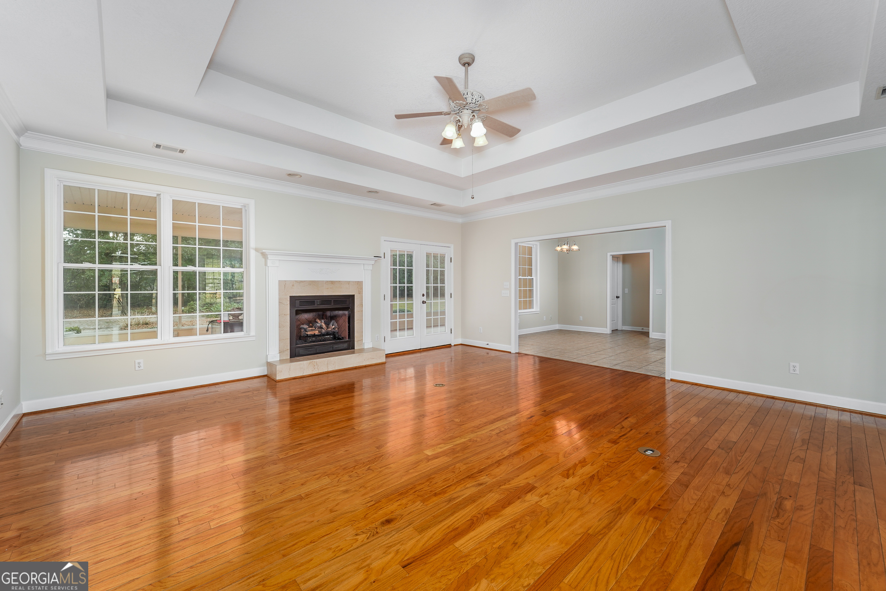 4023 Redstone Circle Blackshear, GA 31516 - Photo 10 of 27 a view of an empty room with wooden floor and a window