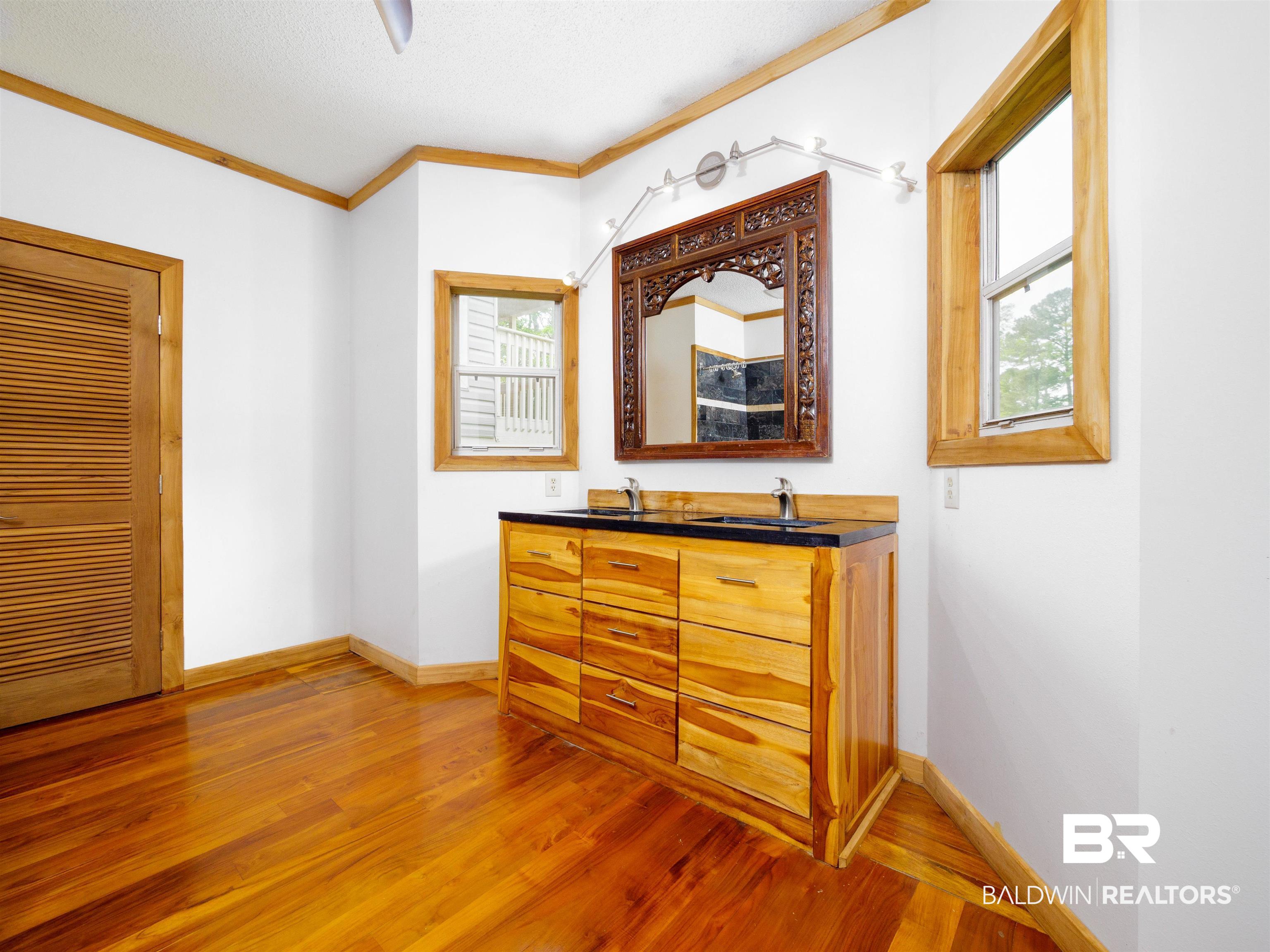 12831 Clay City Road Fairhope, AL 36532 - Photo 16 of 47 Dual vanities with windows to keep the area bright