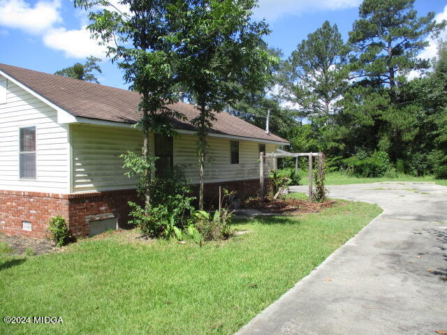 923 Chappell Mill Road Montrose, GA 31065 - Photo 17 of 21 a view of a house with backyard and sitting area