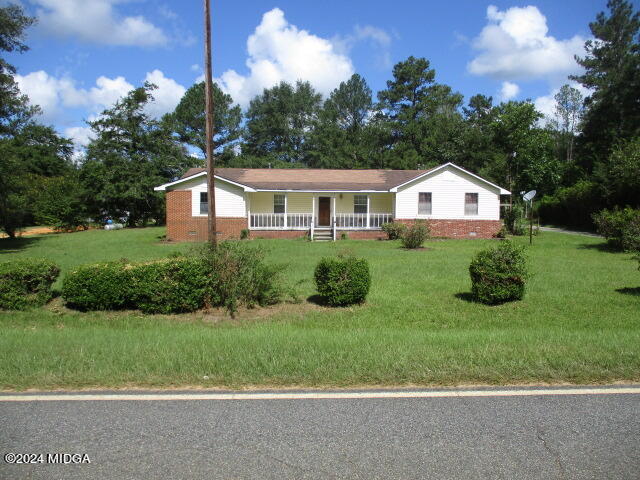 923 Chappell Mill Road Montrose, GA 31065 - Photo 18 of 21 a view of a house with a big yard potted plants and large tree