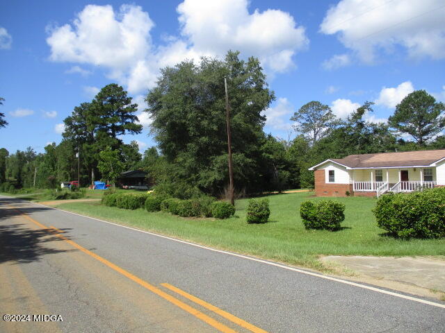 923 Chappell Mill Road Montrose, GA 31065 - Photo 20 of 21 a front view of a house with a yard and trees