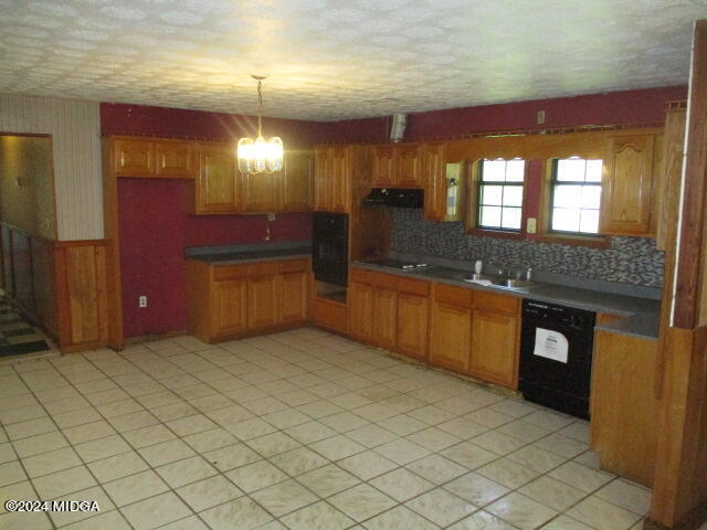 923 Chappell Mill Road Montrose, GA 31065 - Photo 2 of 21 a kitchen with stainless steel appliances granite countertop a sink and a stove