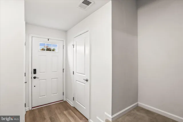 a bathroom with a toilet sink and shower