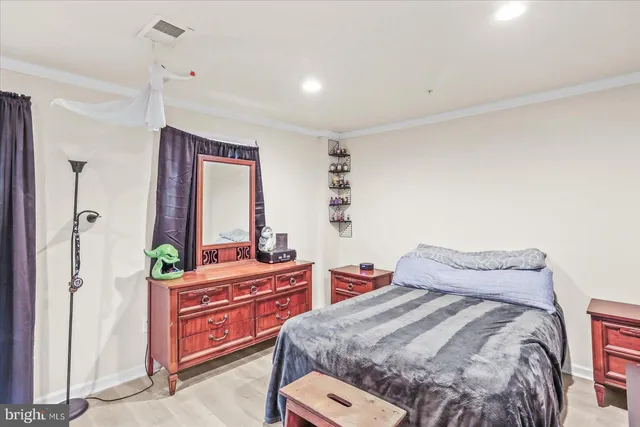 a view of an empty room and wooden floor