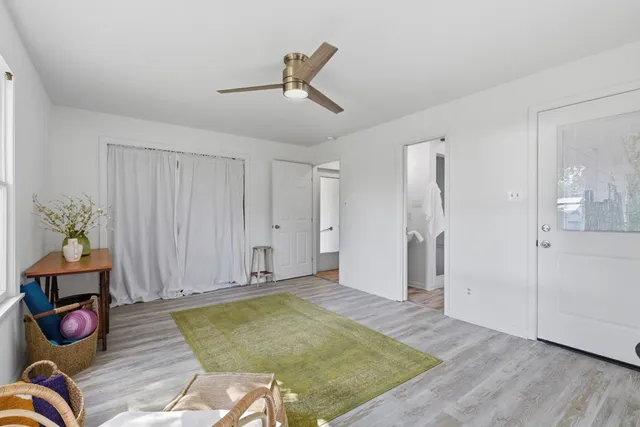 a view of an empty room and wooden floor