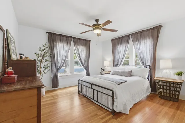 a bedroom with a large bed and a window