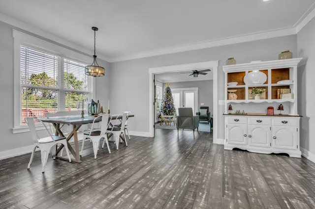 a living room with furniture a window and a fireplace