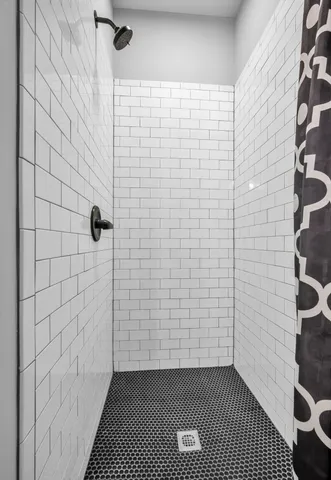 a bedroom with furniture and a wooden floor