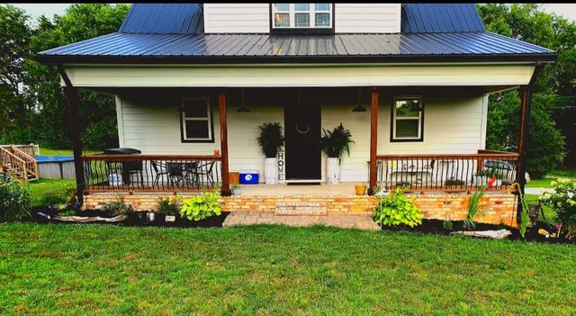a front view of a house with garden