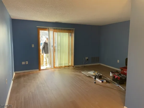 an empty room with a empty space and window
