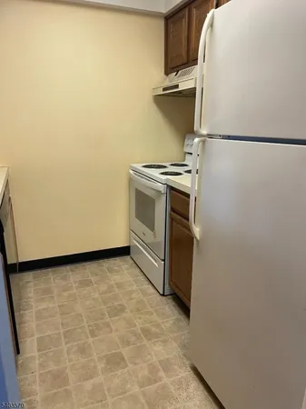 a view of a storage & utility room with washer and dryer