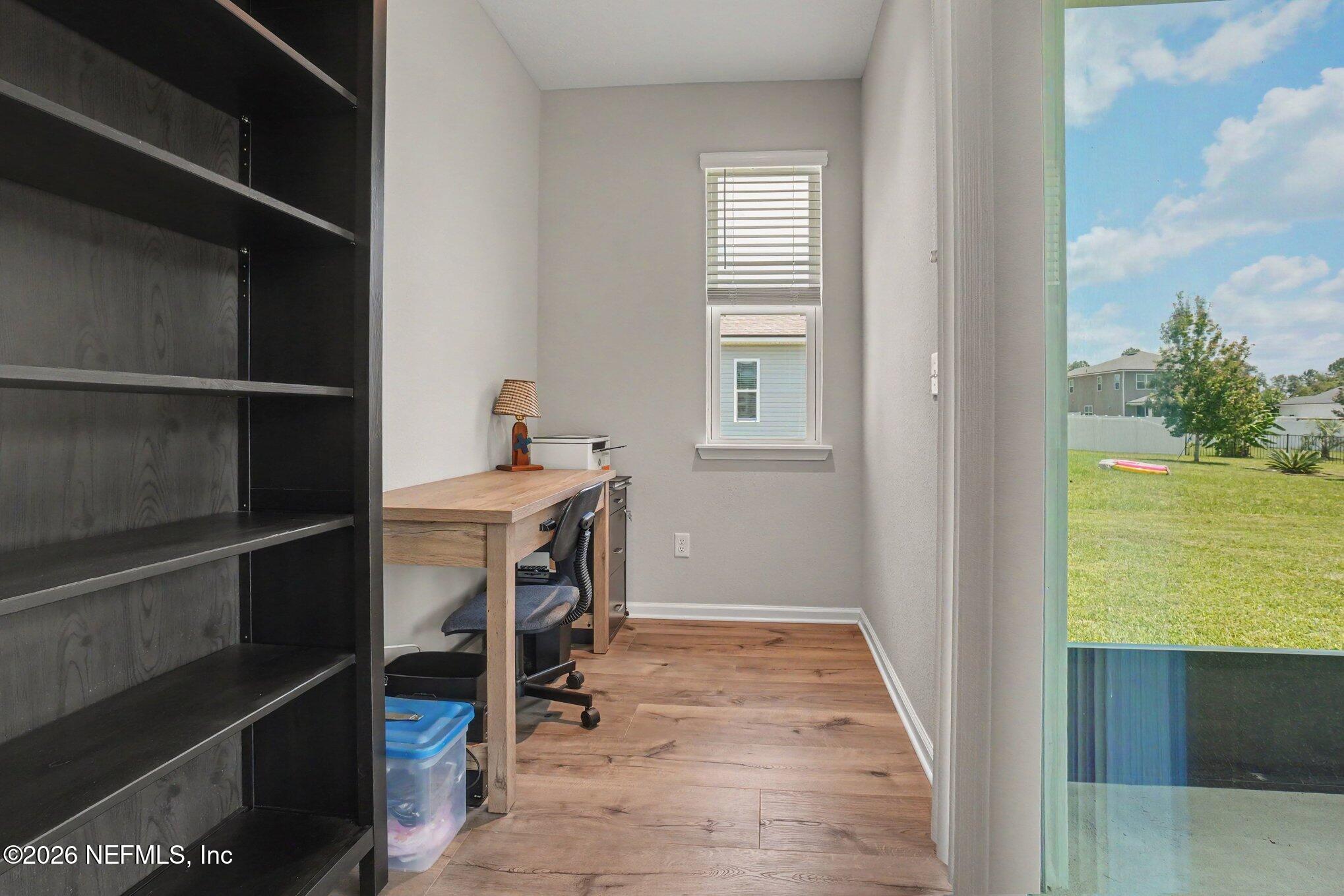 4630 Pine Ridge Parkway Middleburg, FL 32068 - Photo 12 of 35 a room that has a window and a table in it