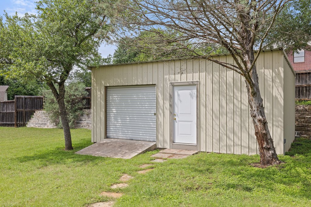 12135 Fitzhugh Road Austin, TX 78736 - Photo 29 of 30 a view of a backyard with a large tree