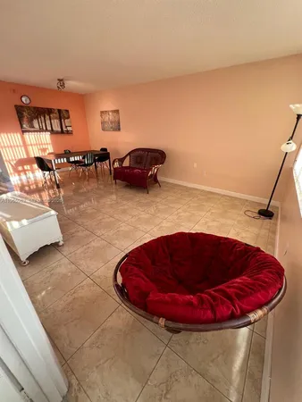 a room with a couch and a toilet