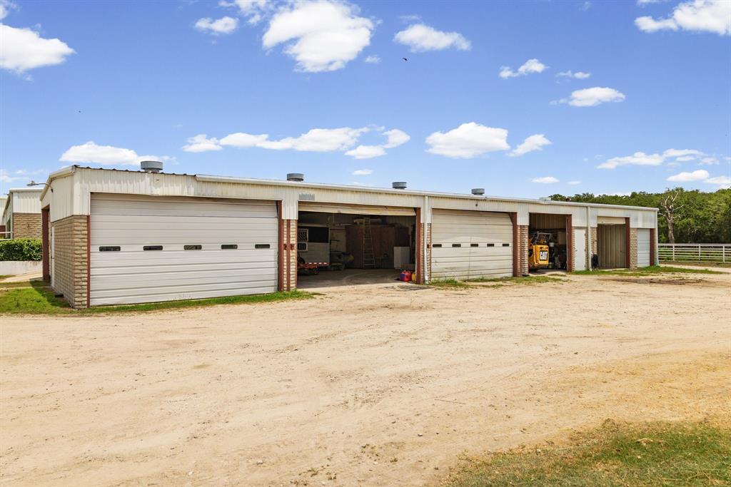 4509 Diamond D Road Lone Oak, TX 75453 - Photo 28 of 36 a big room with yellow lighting in front of it