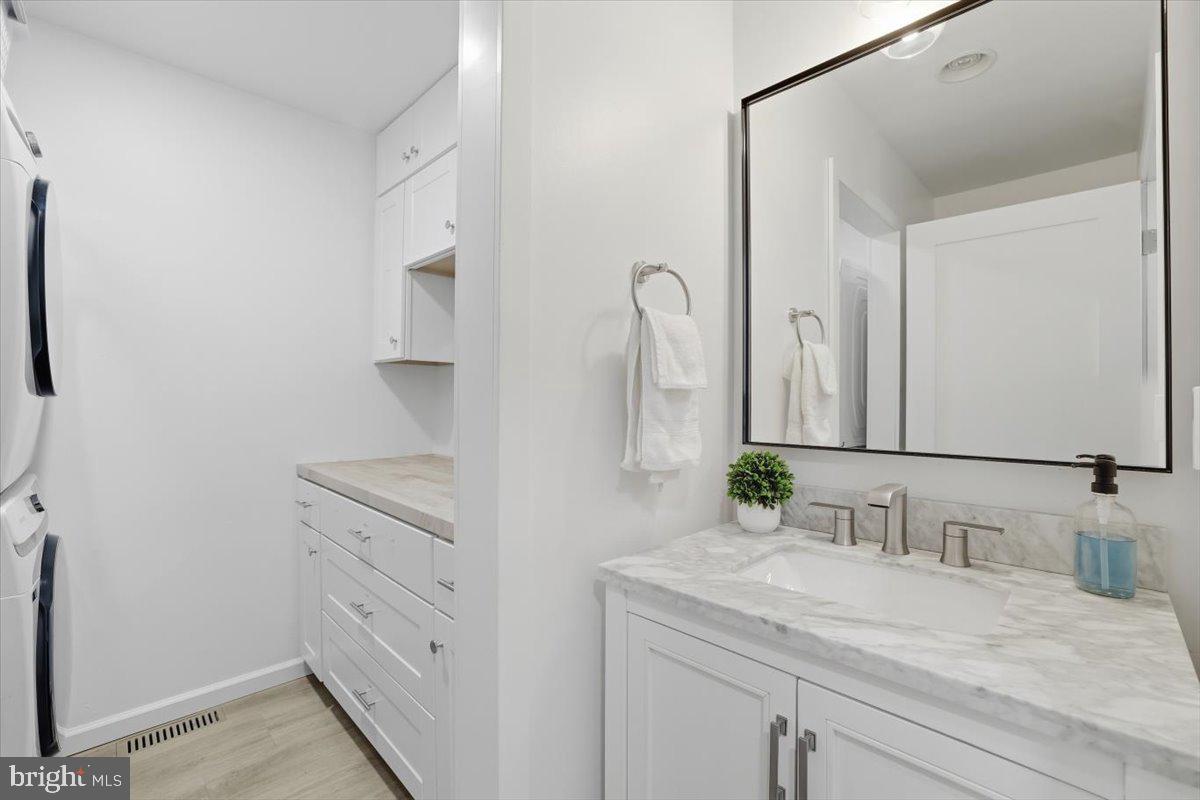 128 Lidio Road Blakeslee, PA 18610 - Photo 19 of 63 a bathroom with a granite countertop sink and a mirror