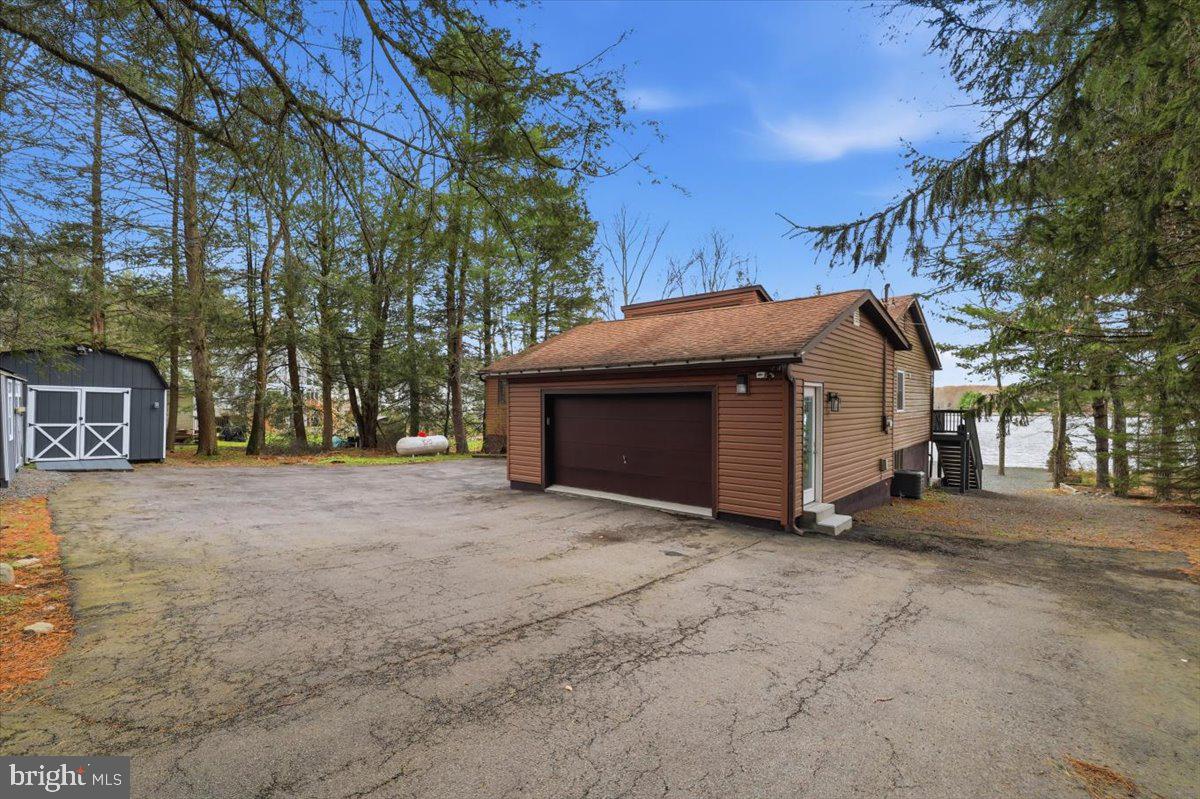128 Lidio Road Blakeslee, PA 18610 - Photo 2 of 63 a view of a house with a yard and tree