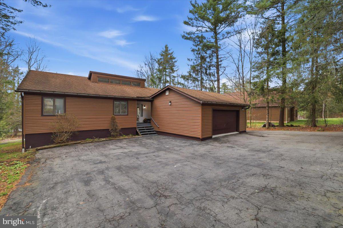 128 Lidio Road Blakeslee, PA 18610 - Photo 3 of 63 a view of a house with a backyard