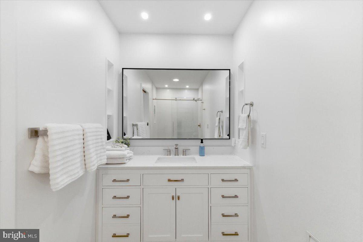 128 Lidio Road Blakeslee, PA 18610 - Photo 33 of 63 a bathroom with a sink vanity and mirror
