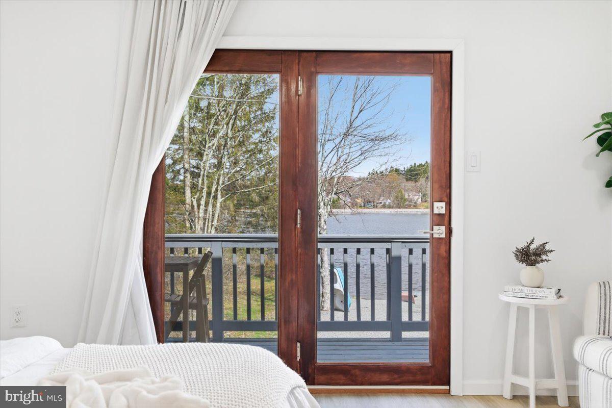 128 Lidio Road Blakeslee, PA 18610 - Photo 34 of 63 a bedroom with a bed and a window