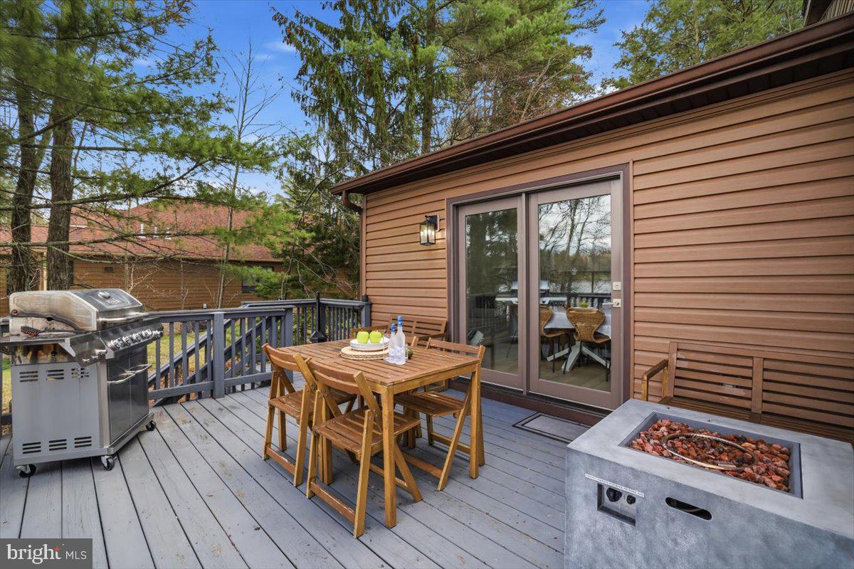 128 Lidio Road Blakeslee, PA 18610 - Photo 41 of 63 a balcony with furniture and wooden floor