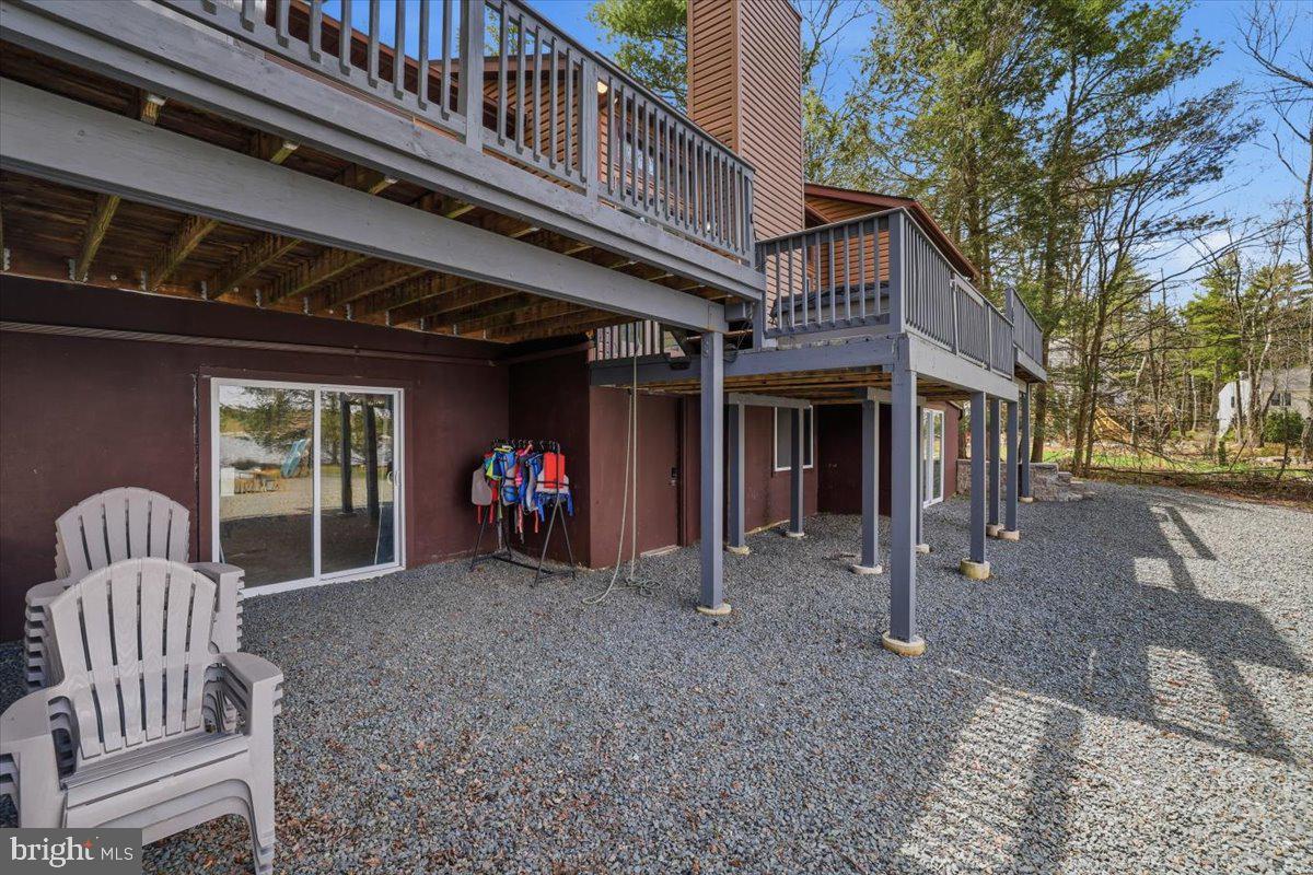 128 Lidio Road Blakeslee, PA 18610 - Photo 47 of 63 a view of a house with a porch and a large tree