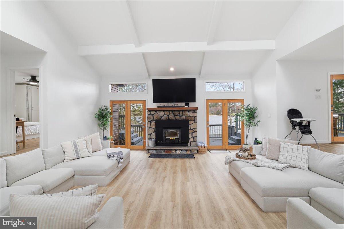 128 Lidio Road Blakeslee, PA 18610 - Photo 8 of 63 a living room with furniture a flat screen tv and a fireplace