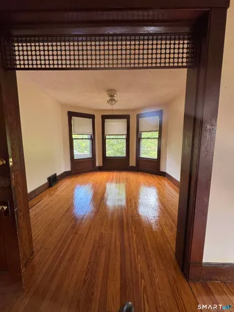 wooden floor in a hall with an entryway
