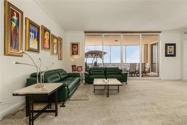 a living room with furniture a rug and a wall painting