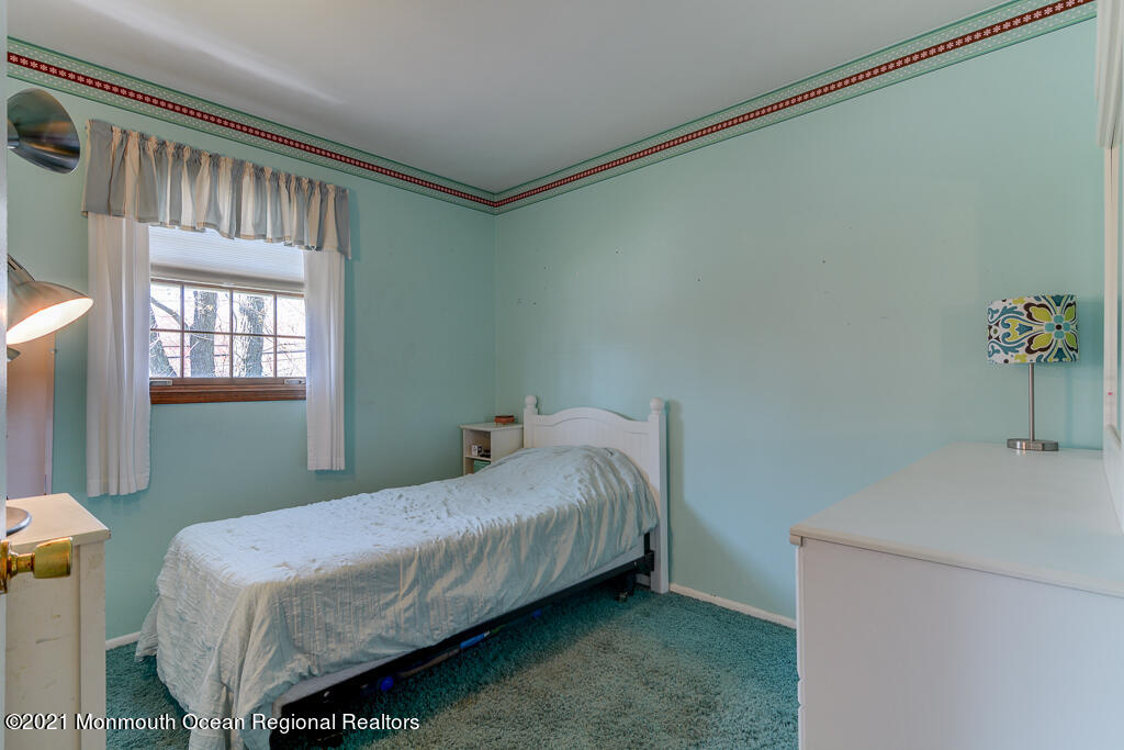 9 Neal Street Jackson, NJ 08527 - Photo 12 of 22 a bedroom with a bed and a window