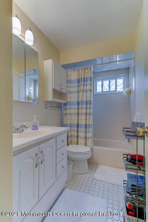 9 Neal Street Jackson, NJ 08527 - Photo 13 of 22 a bathroom with a sink a toilet and shower