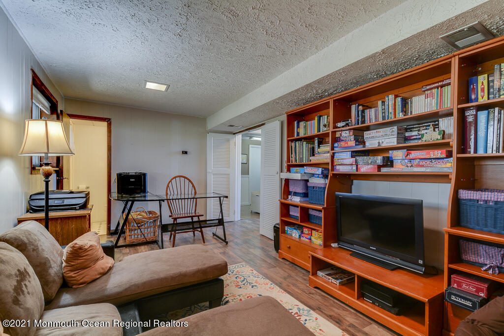 9 Neal Street Jackson, NJ 08527 - Photo 14 of 22 a living room with furniture and a flat screen tv