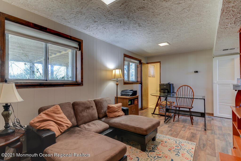 9 Neal Street Jackson, NJ 08527 - Photo 15 of 22 a living room with furniture wooden floor and a window