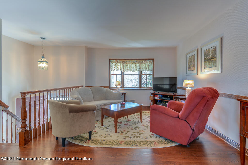 9 Neal Street Jackson, NJ 08527 - Photo 4 of 22 a living room with furniture and a window