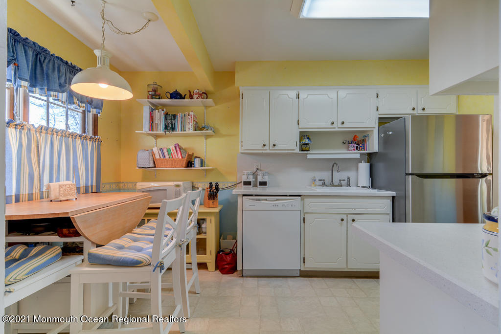 9 Neal Street Jackson, NJ 08527 - Photo 7 of 22 a kitchen with a sink appliances and cabinets