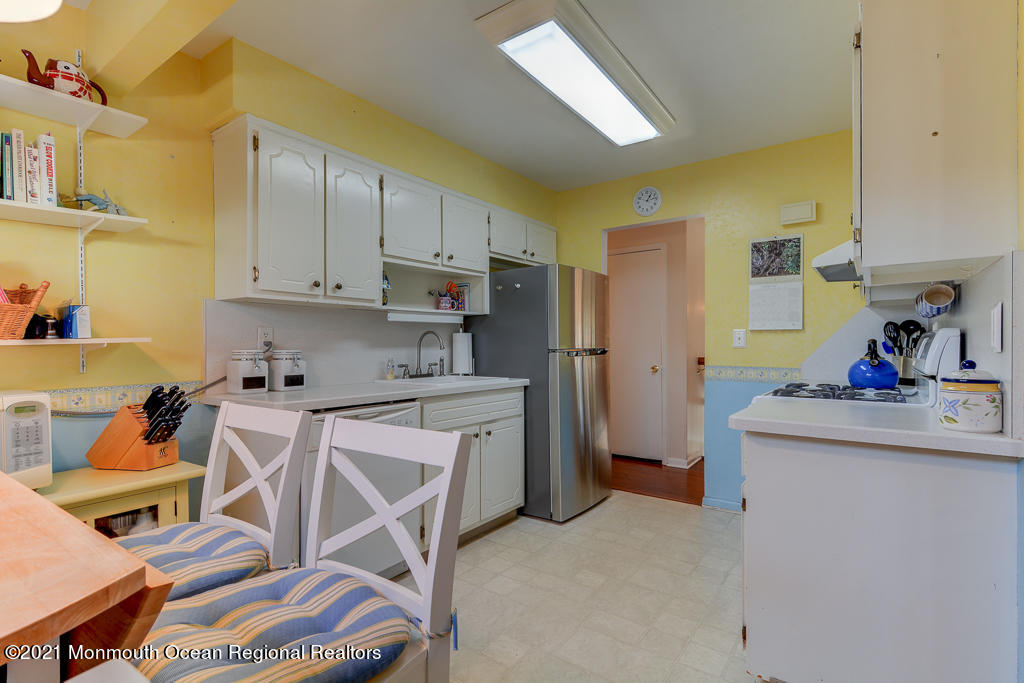 9 Neal Street Jackson, NJ 08527 - Photo 8 of 22 a kitchen that has a lot of cabinets in it and appliances