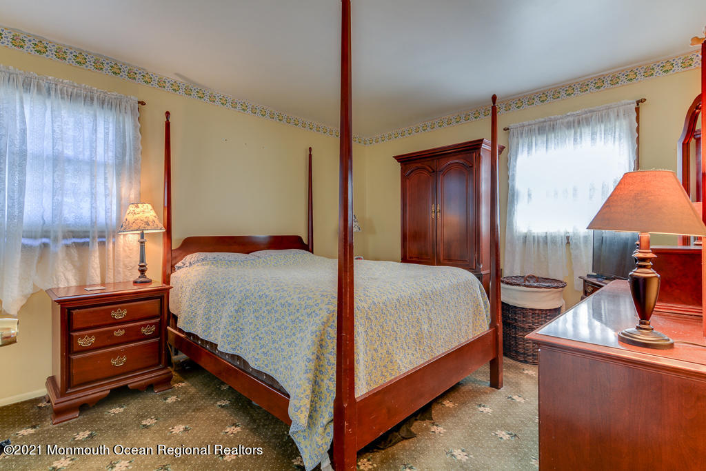 9 Neal Street Jackson, NJ 08527 - Photo 10 of 22 a bedroom with a bed and a dresser with mirror