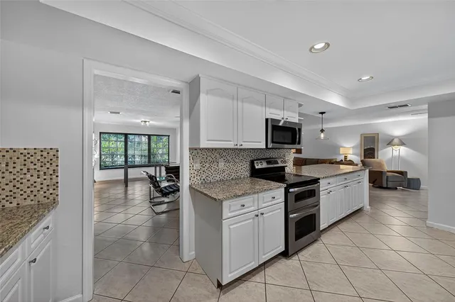 a bedroom with a bed and a view of bathroom