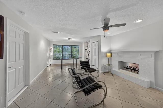 a bedroom with furniture and a large window