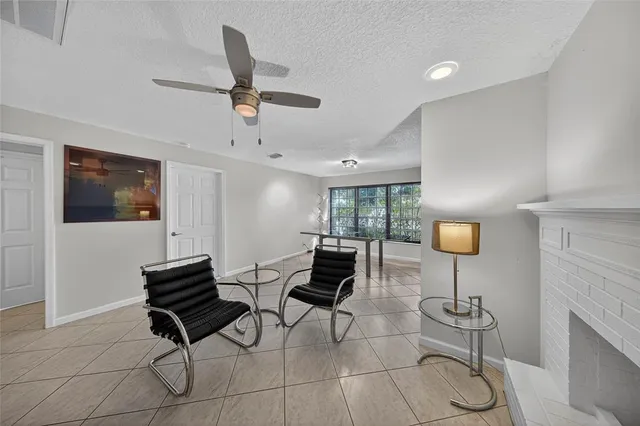 a bedroom with a bed a table and chair