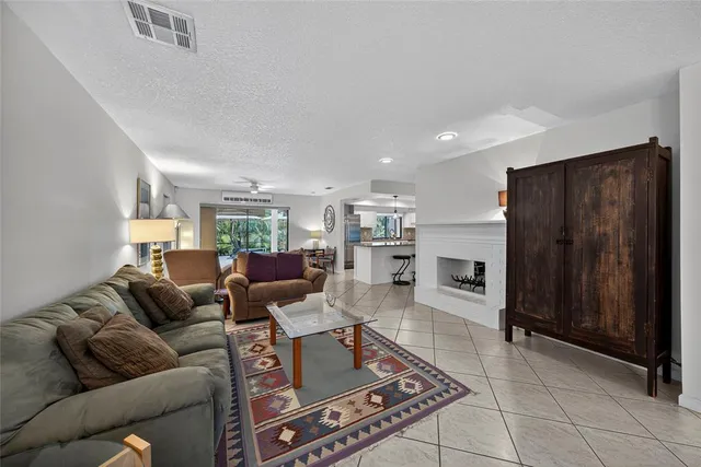 a kitchen with a sink a counter and cabinets