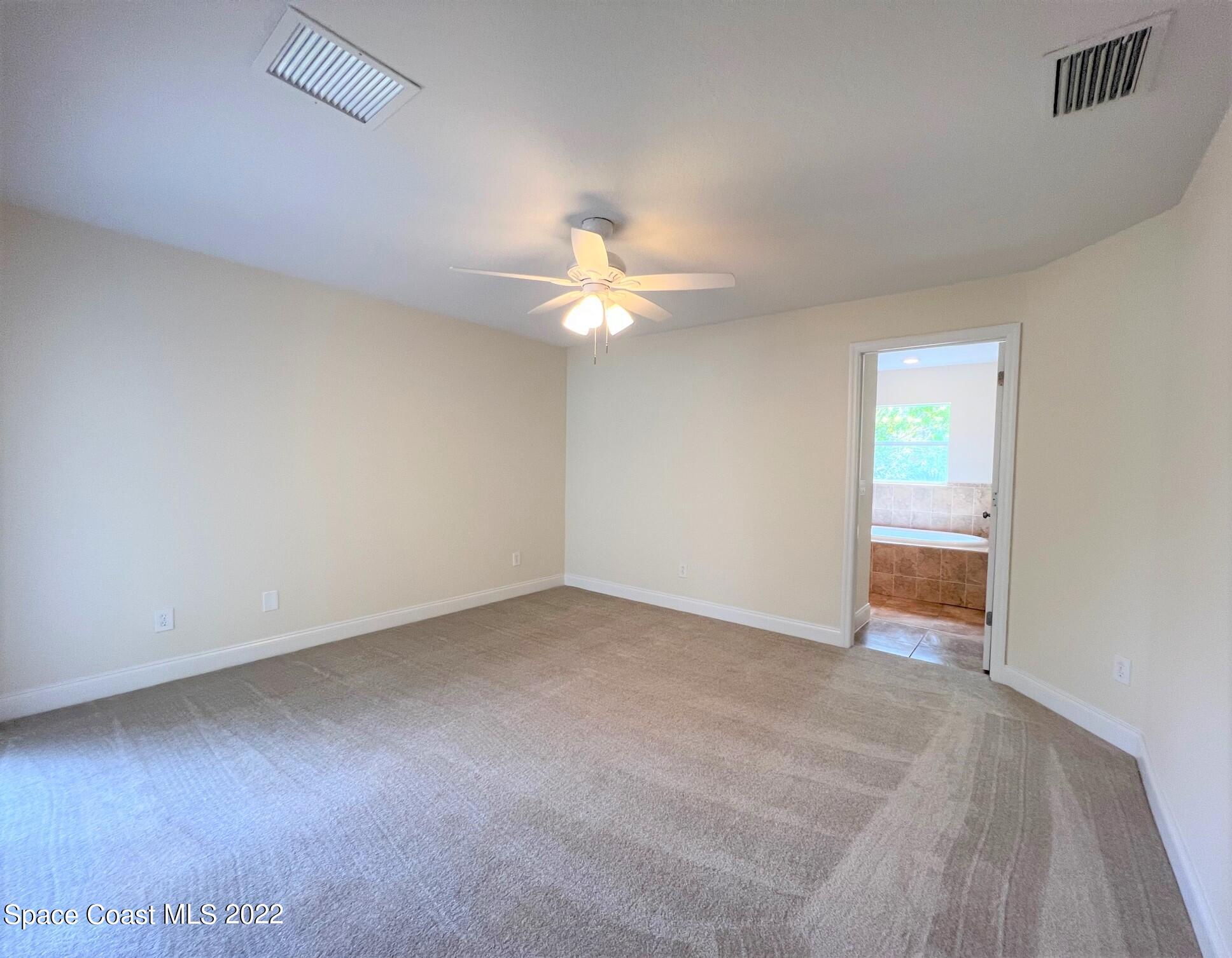 812 Tedder Road Southeast Palm Bay, FL 32909 - Photo 7 of 13 Master Bedroom