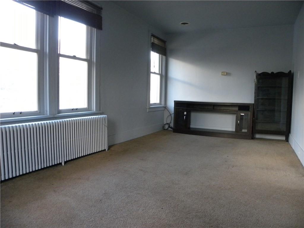 549 State Street Baden, PA 15005 - Photo 12 of 21 a room with a fireplace and window