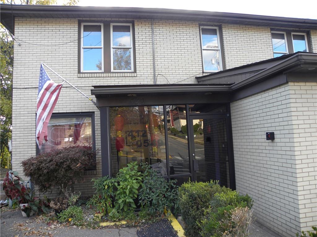 549 State Street Baden, PA 15005 - Photo 3 of 21 a view of a brick house with potted plants