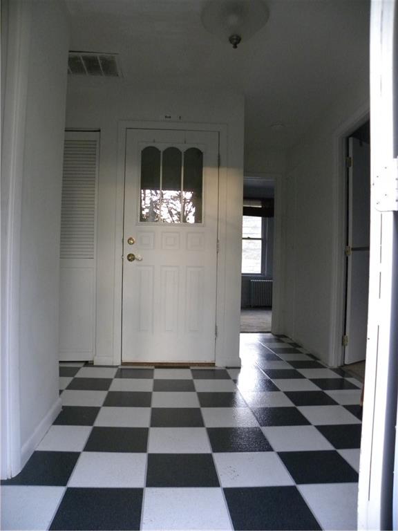 549 State Street Baden, PA 15005 - Photo 10 of 21 a view of a black and white checkered floor with a rug