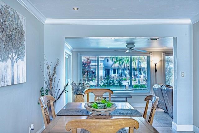 1131 Southeast 5th Avenue Pompano Beach, FL 33060 - Photo 13 of 39 a view of a dining room with furniture a chandelier and wooden floor