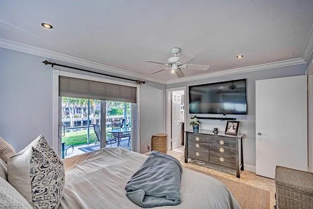 a bedroom with a bed and a television